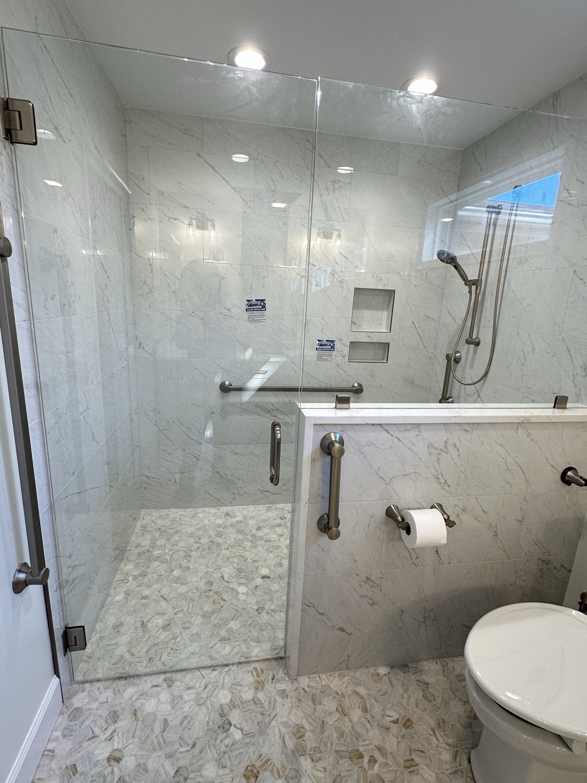 Glass walk in shower by Straight Line Ceramic Tile in Wilmington NC