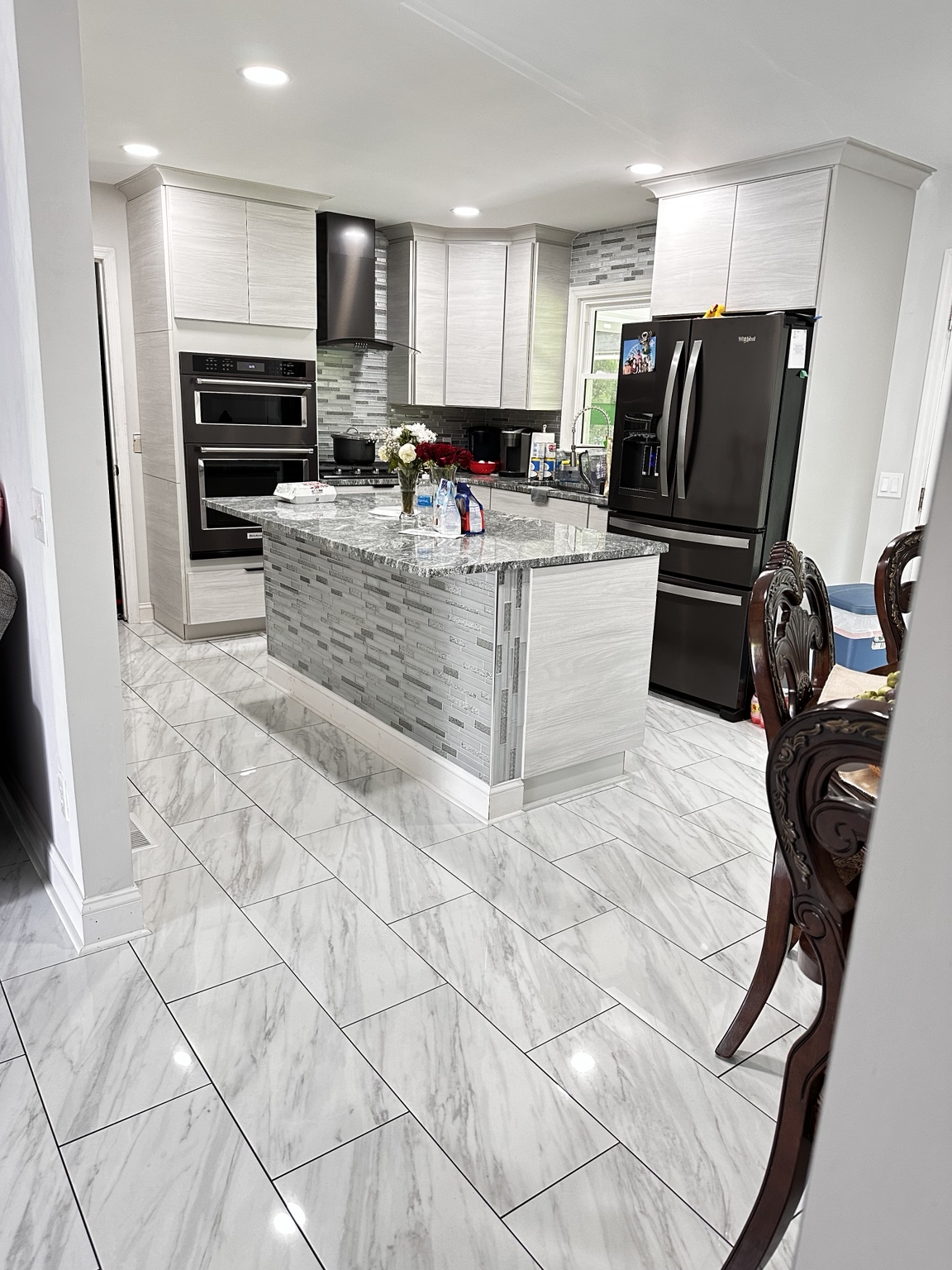 Marble look kitchen floor tile by Straight Line Ceramic Tile in Wilmington NC