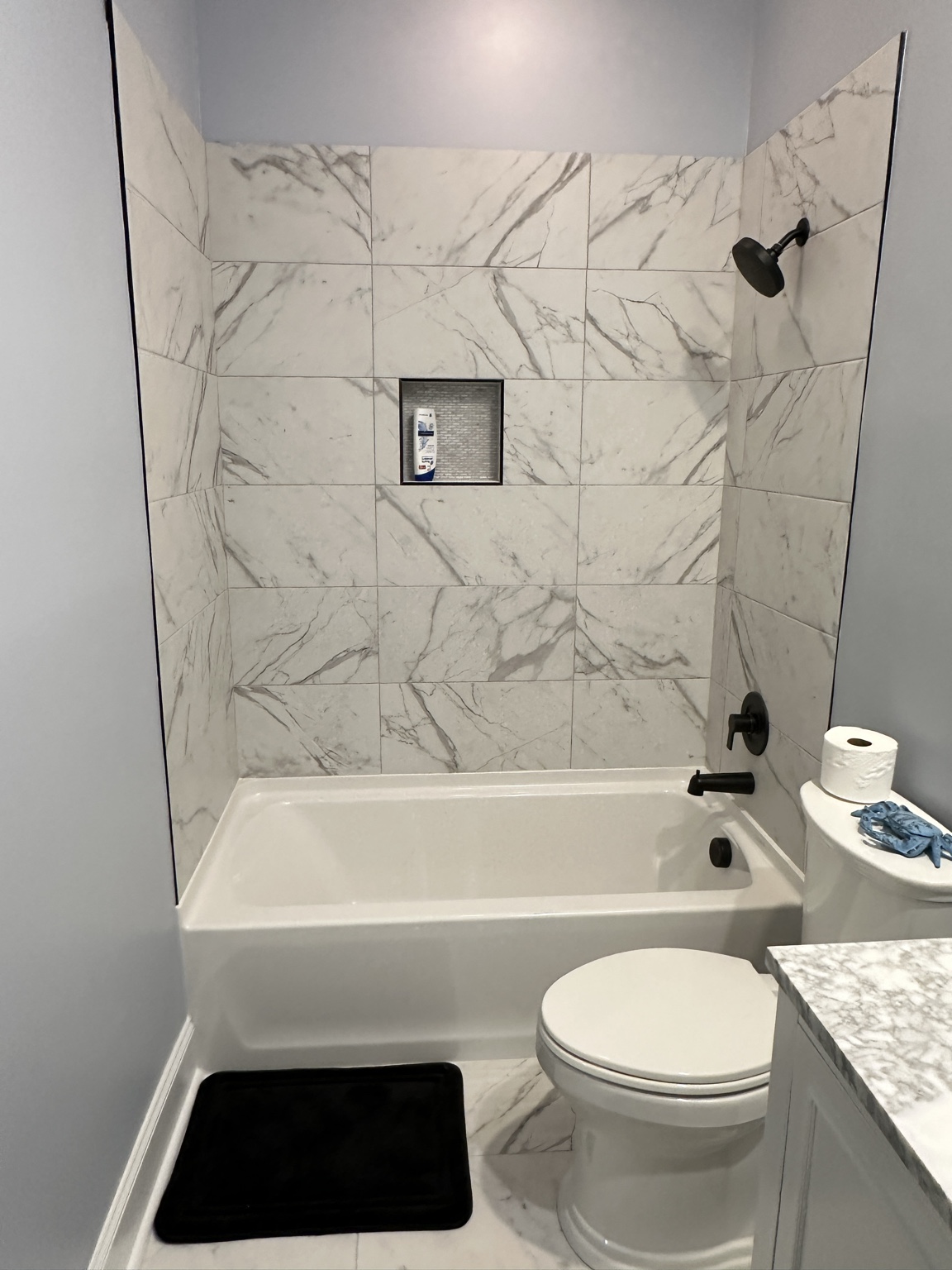 Marble look tile tub surround by Straight Line Ceramic Tile in Wilmington NC